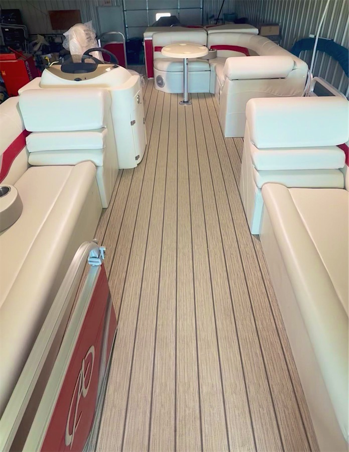 Pontoon boat interior with new seating and woven vinyl floor